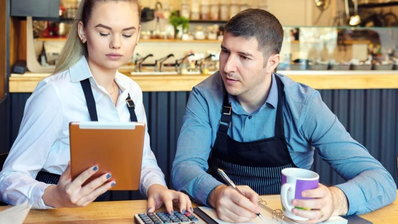 Small business owners calculating their monthly cashflow Courtesy : Getty