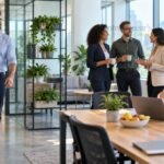 Entrepreneurs and business leaders taking a healthy break in a bright modern workplace, representing wellness, balanced leadership, physical health and sustainable business performance.